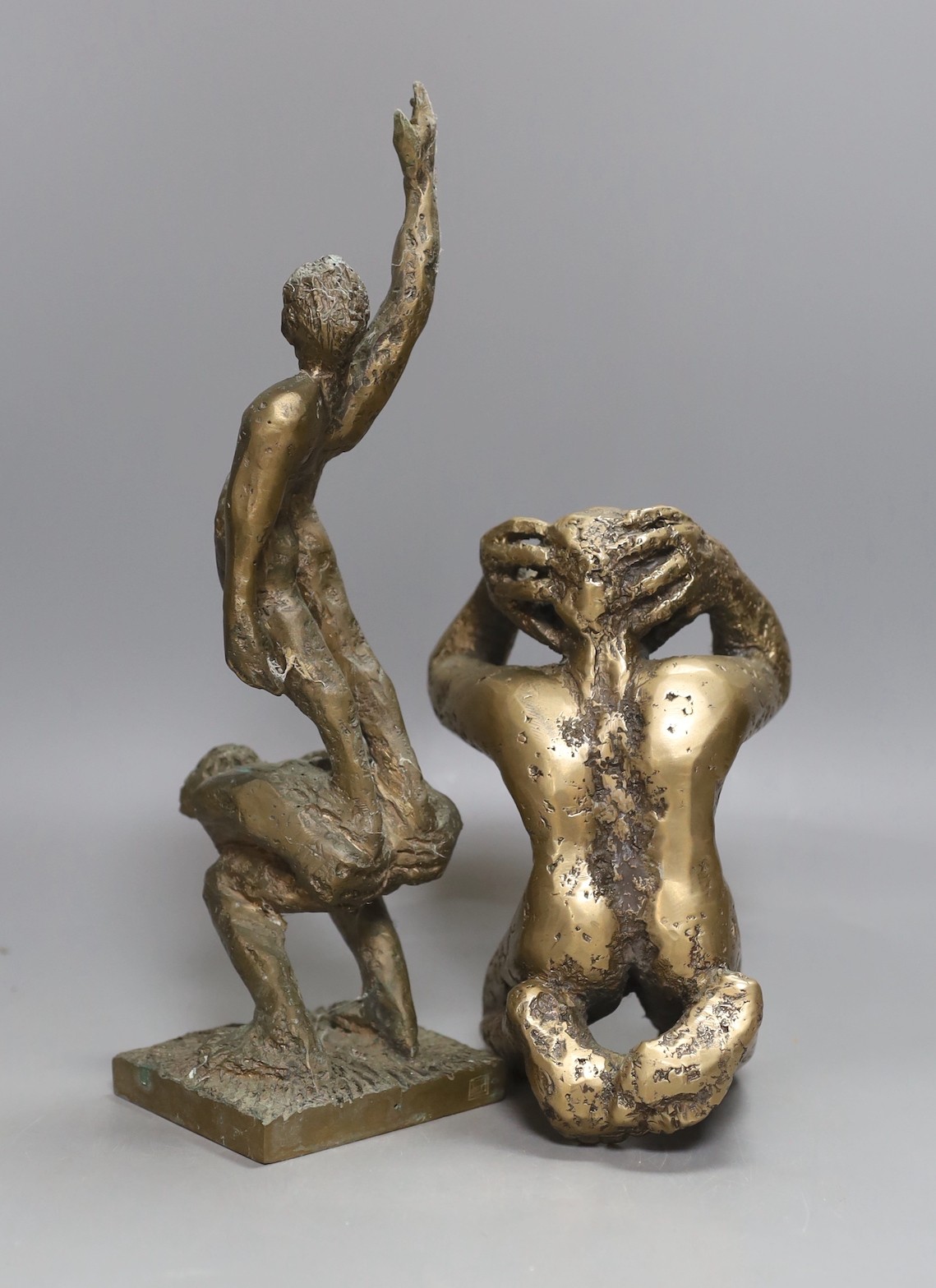 Two cast bronze abstract figure groups, one stamped. 30cm